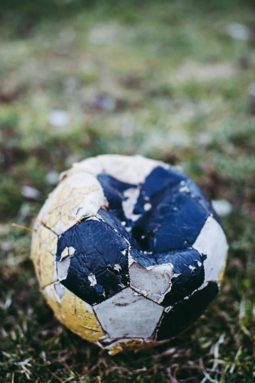 the top of a soccer ball sitting on grass