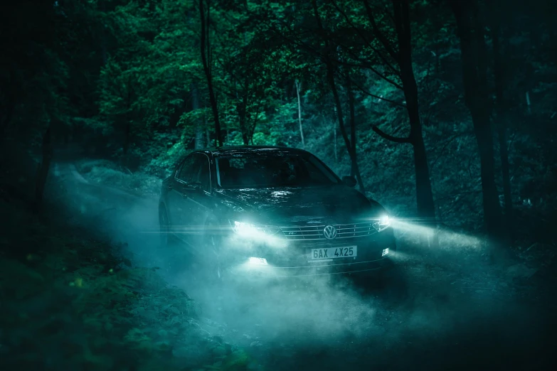 an suv is driving through the woods at night