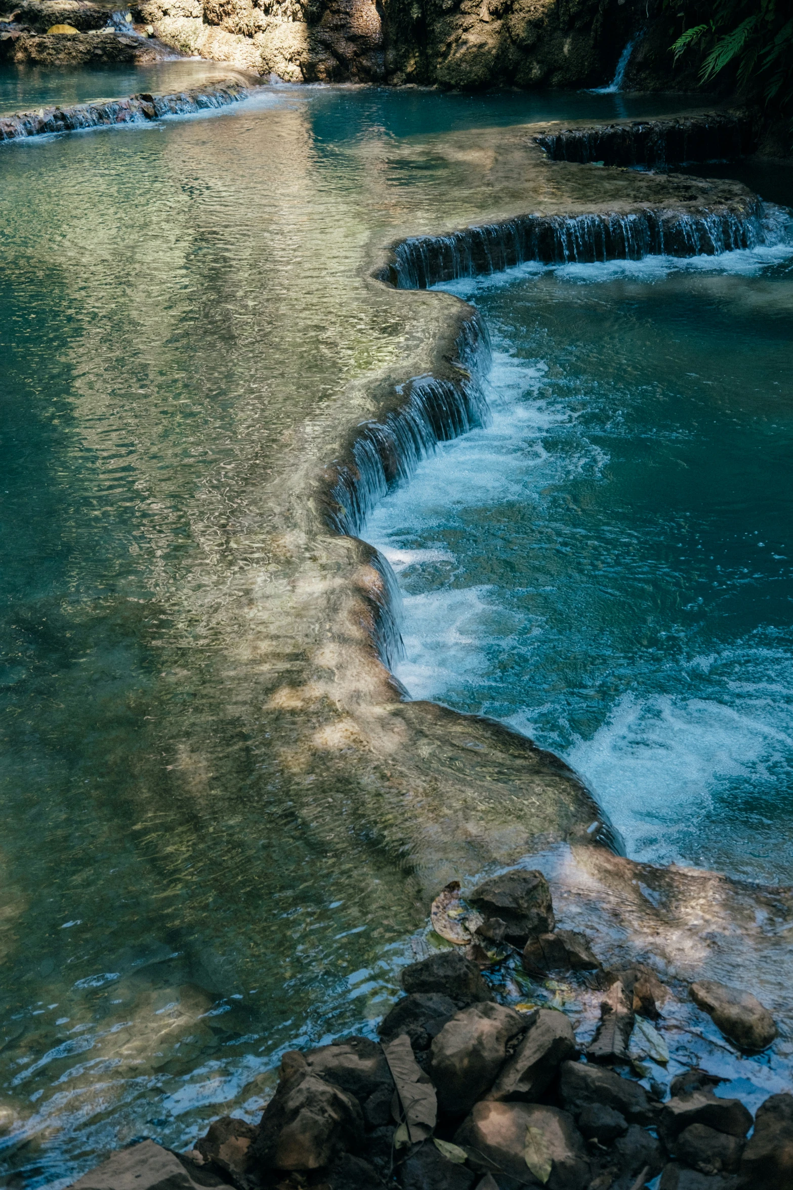 a body of water surrounded by trees and rocks