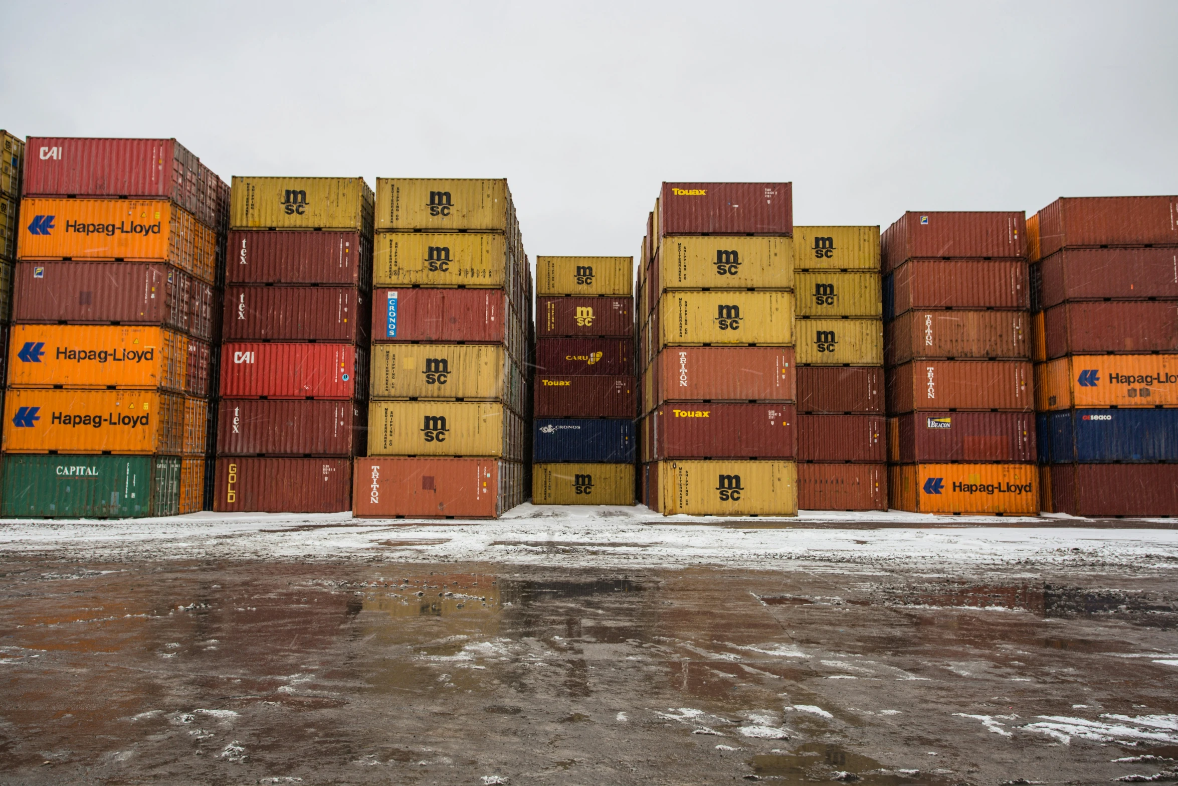 several cargo containers stacked on top of each other