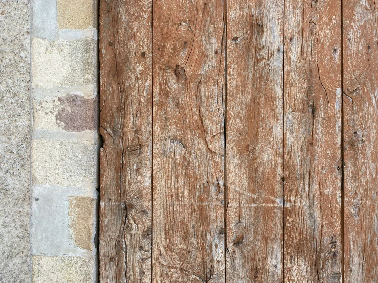 a wooden fence on top of cement