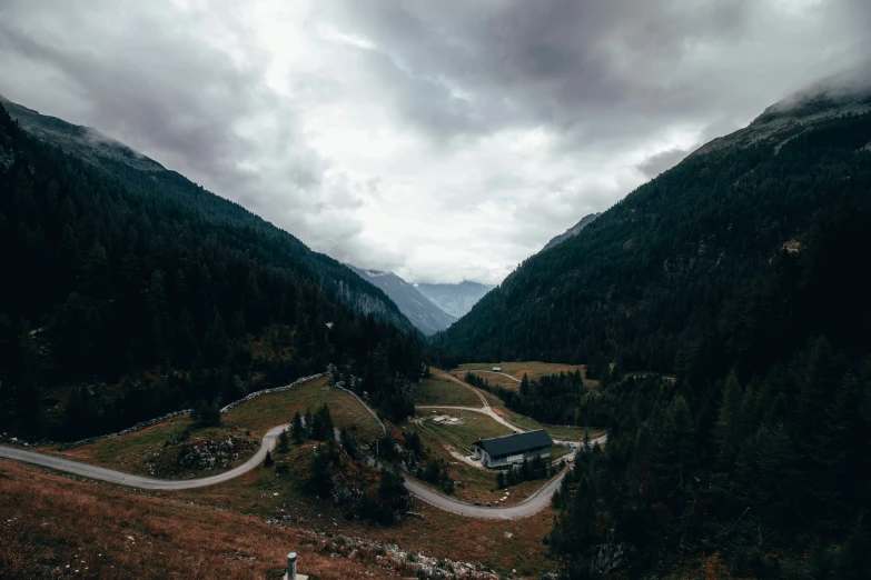 a view of some mountains and valleys on a cloudy day