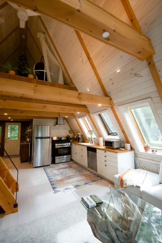 an attic with high ceilings and wood beams