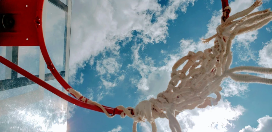 the bottom of a basketball hoop with plastic and string