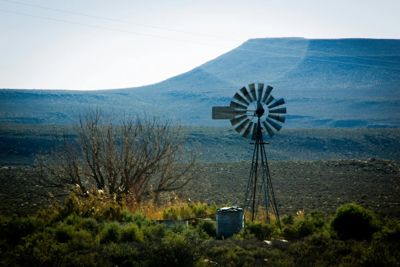 a windmill sitting in the middle of nowhere
