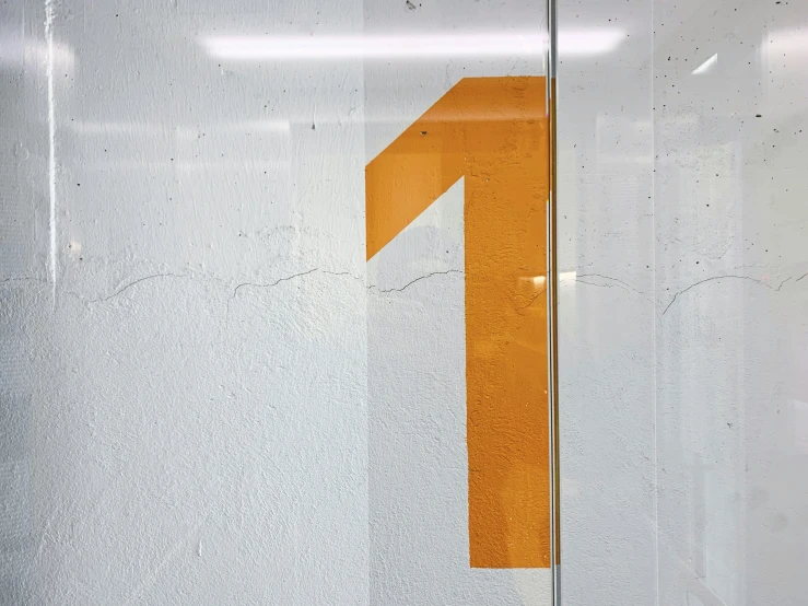 an orange number two painted on a large glass