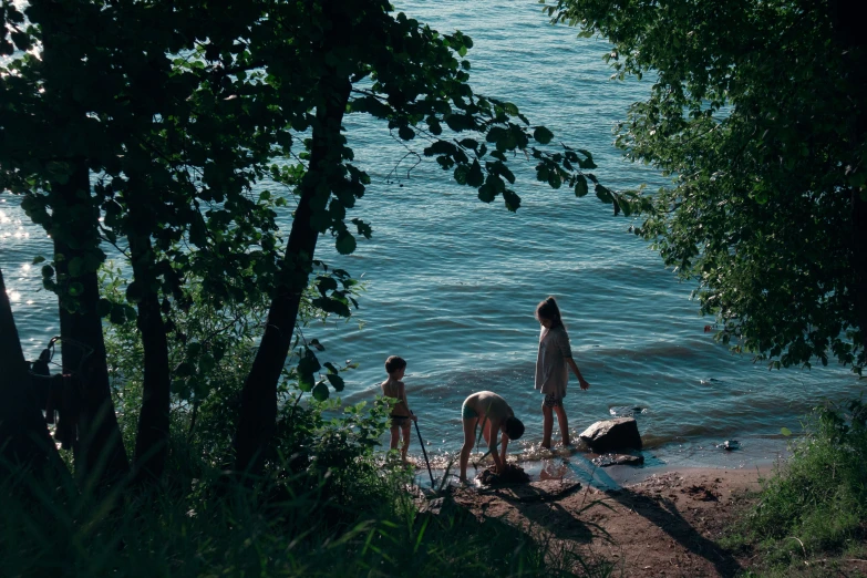 s playing on the shore of the river