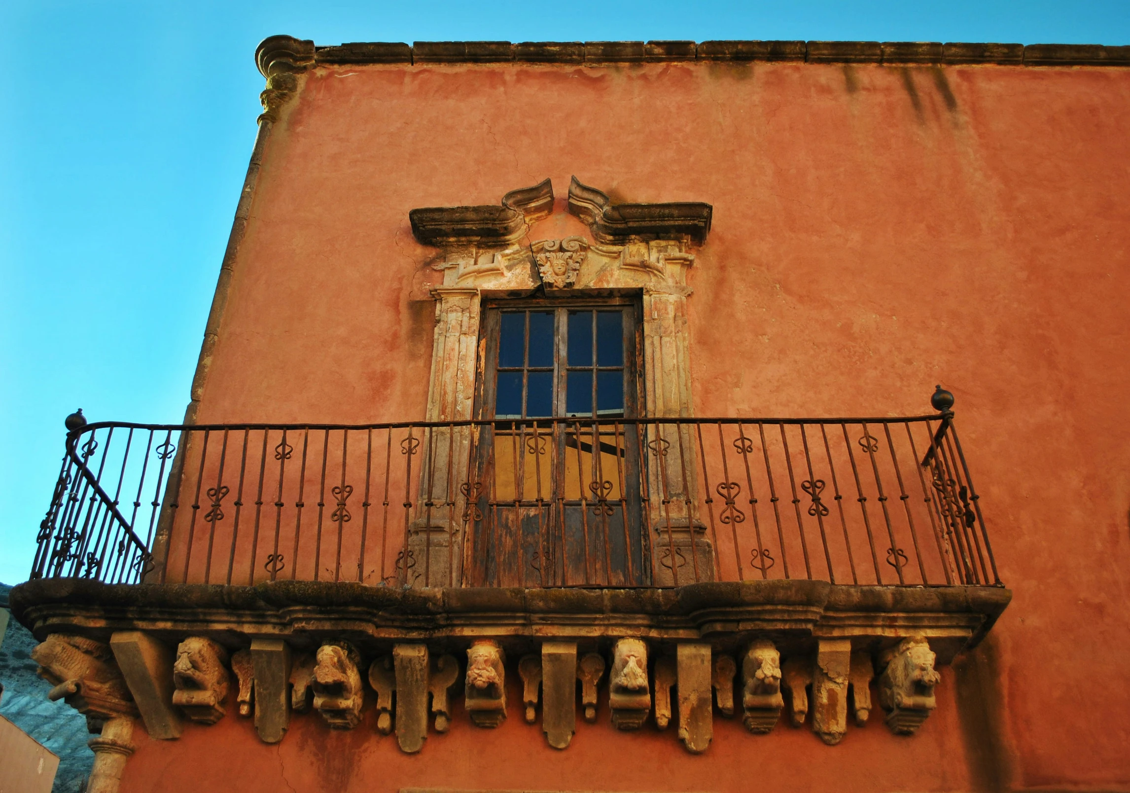 an old building with a metal balustrade