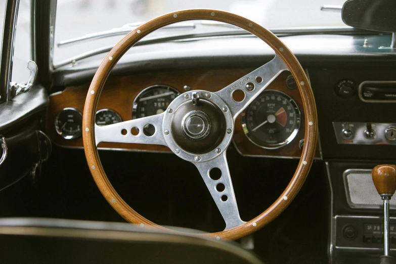 an old car with a steering wheel and dashboard