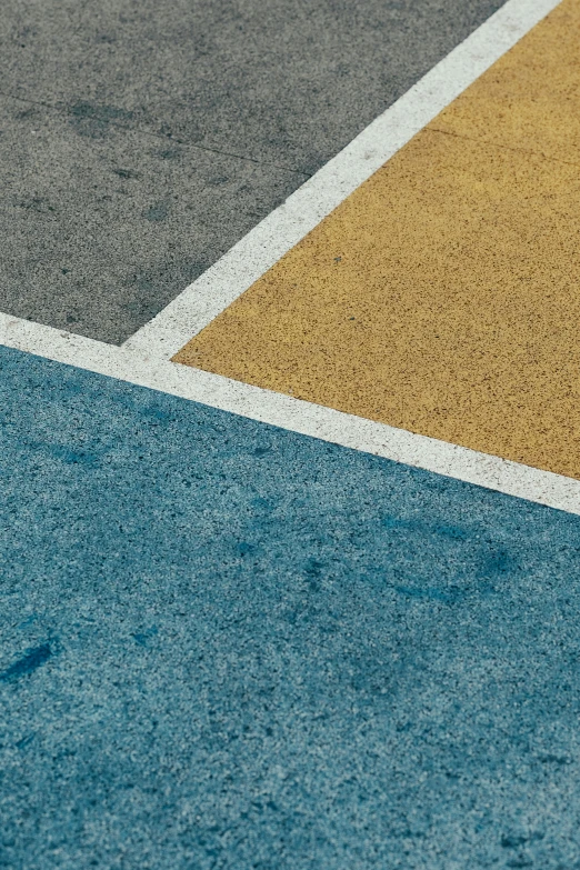 closeup of a yellow and blue tennis court