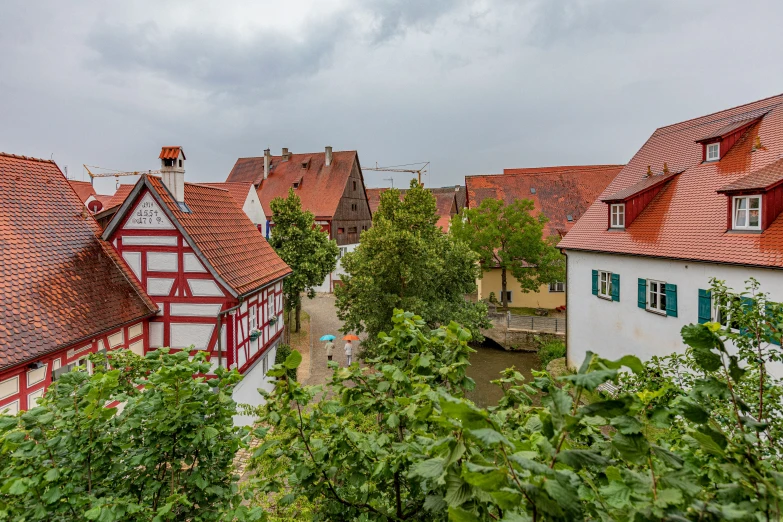 some buildings are standing in the middle of a tree filled field