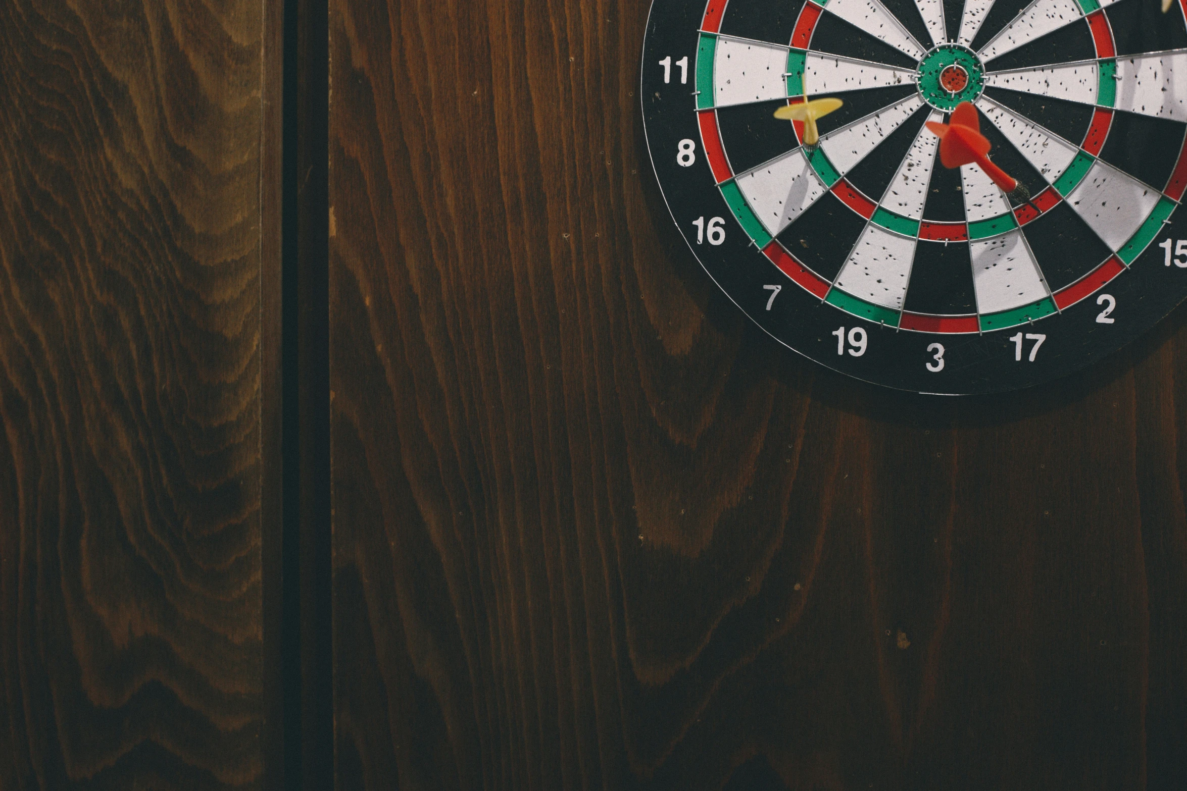 a dart in the middle of a dart board