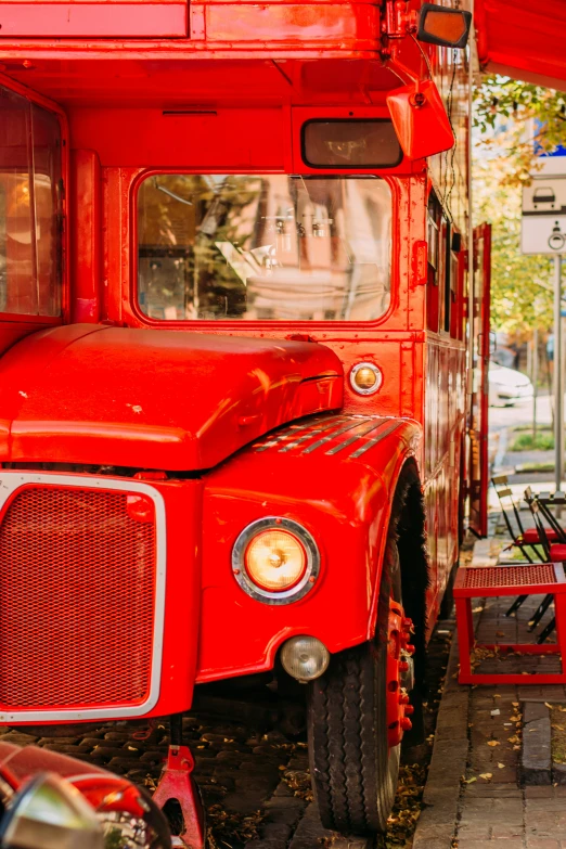 a close up of the front of an old red truck