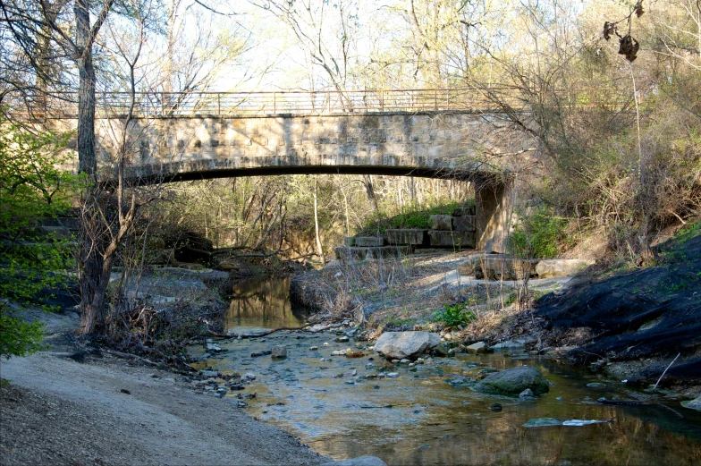 a small river running under a bridge