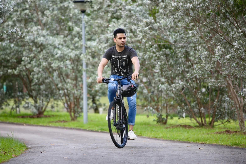 a person riding a bicycle in the park