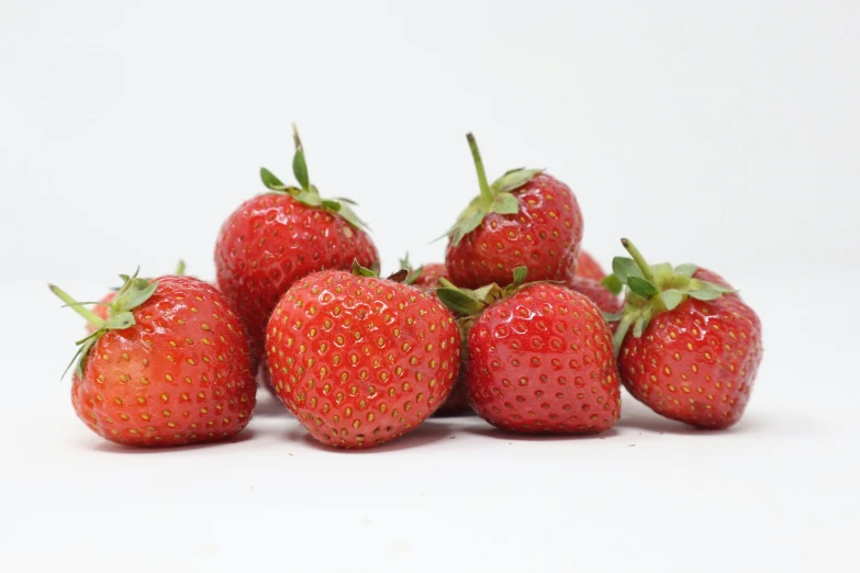 a group of strawberries that are all in the same spot
