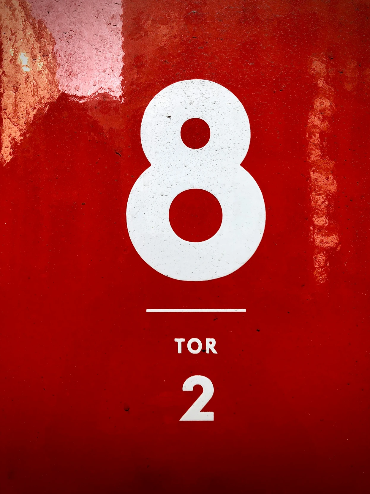 an image of a red sign with the number eight on it