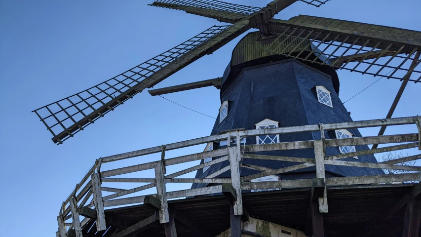 a windmill tower in the sky with its staircase in front