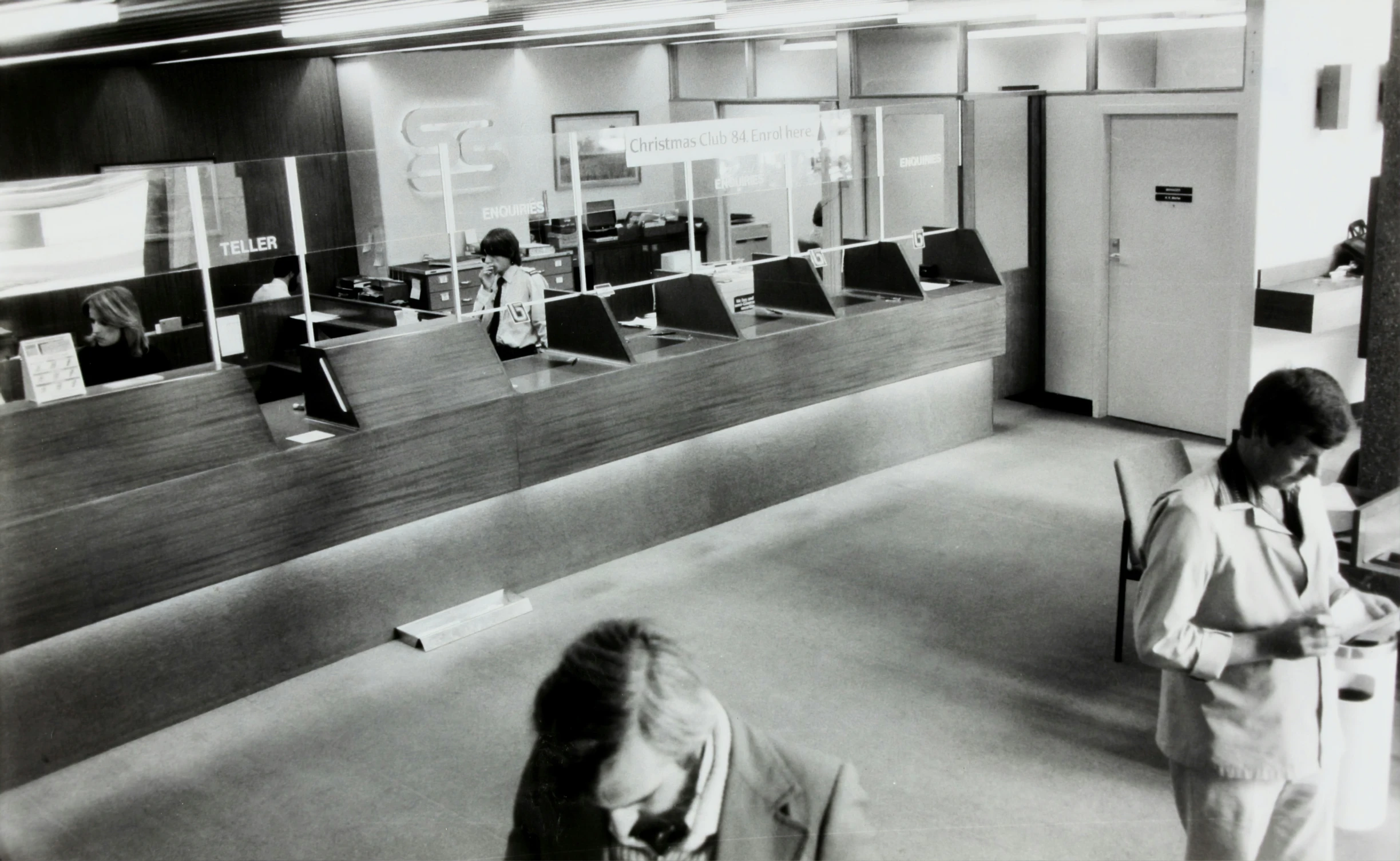 two women browse through the open office