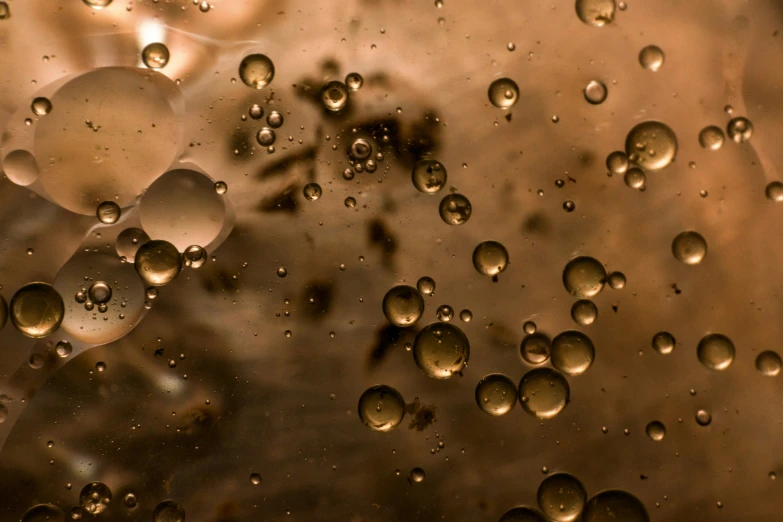 water drops on the surface of a large metal bowl