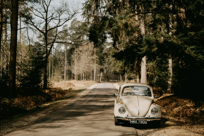 the classic car is parked on the side of the road