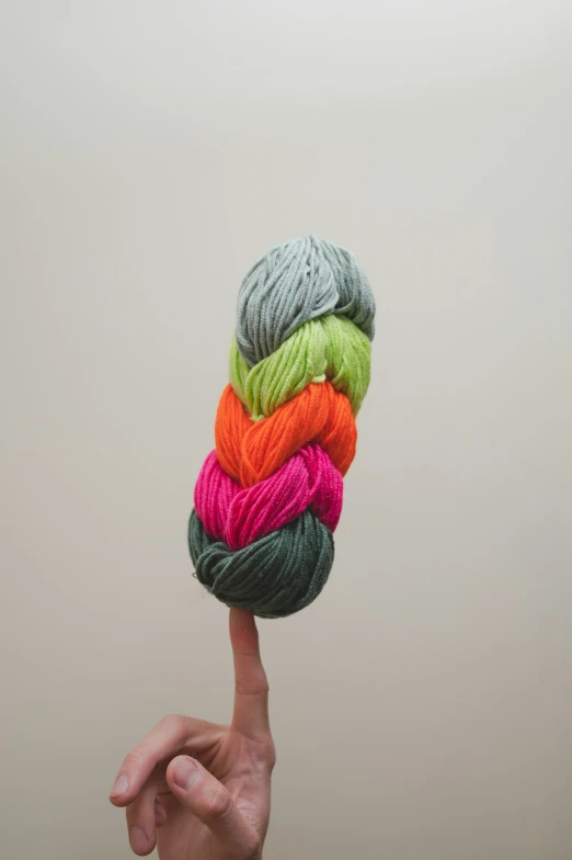 a multicolored skein of yarn in a hand