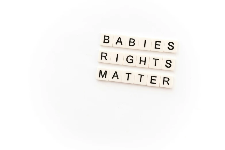 three babys rights and their master are spelled with blocks