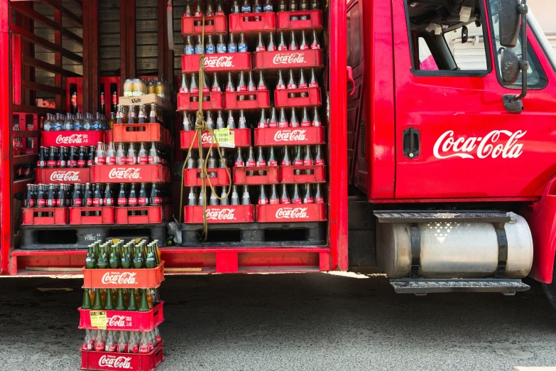 the coca cola truck is full of beer bottles