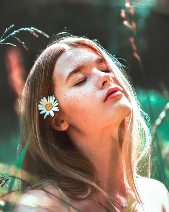 a girl with a flower in her ear