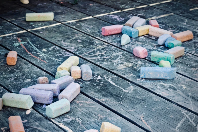 many multicolored wooden blocks sit on the ground