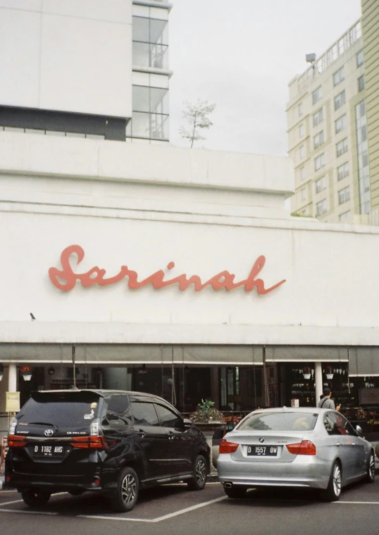 cars are parked in front of the store