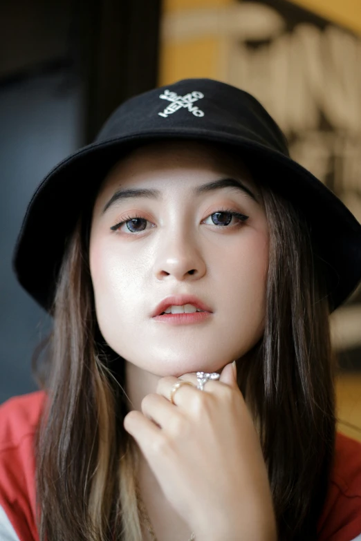 a girl in a red jacket and black hat