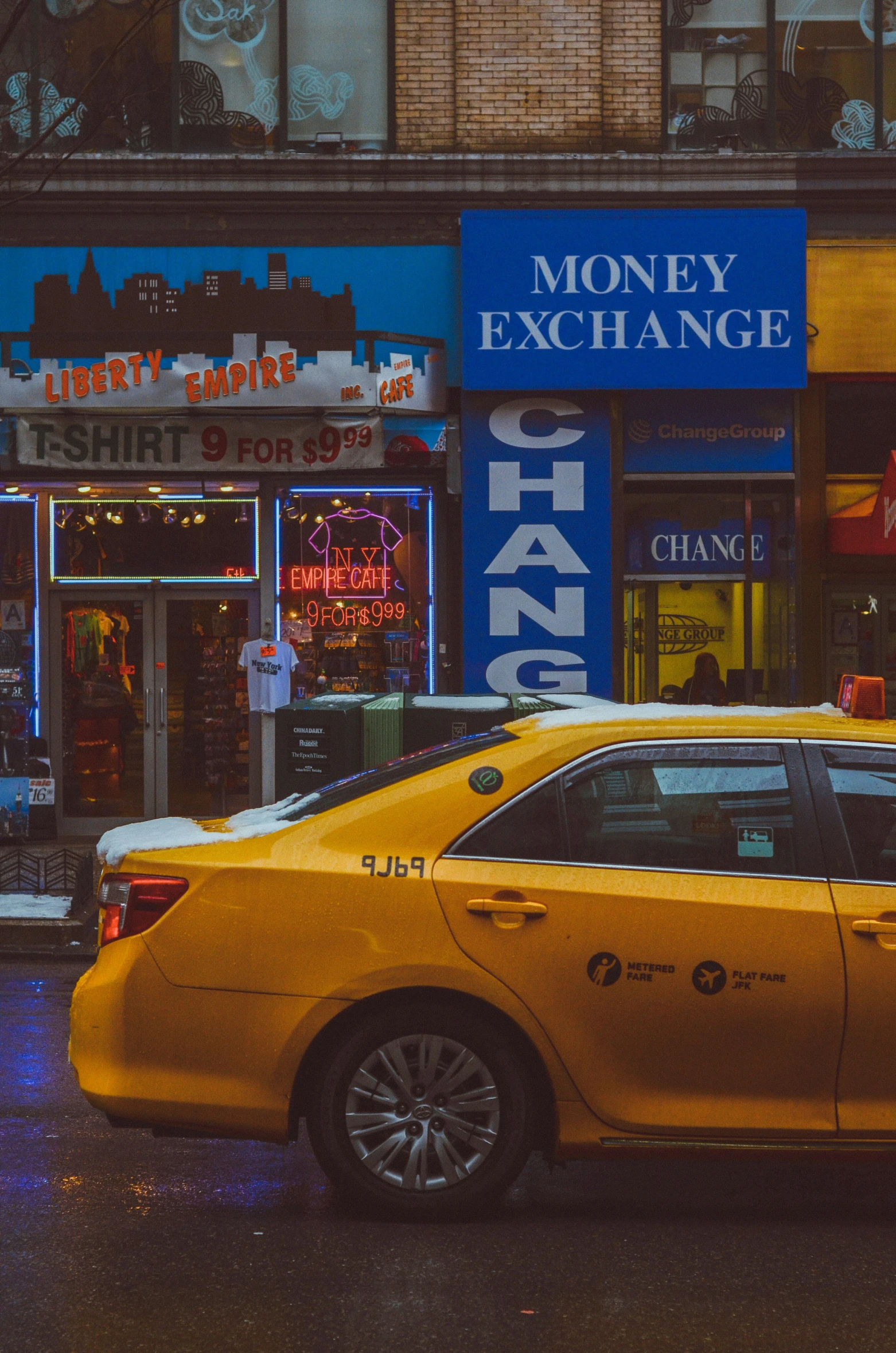 an image of a taxi cab driving down the street