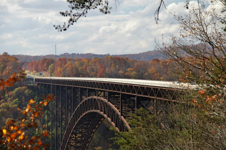 a train riding across a bridge over water