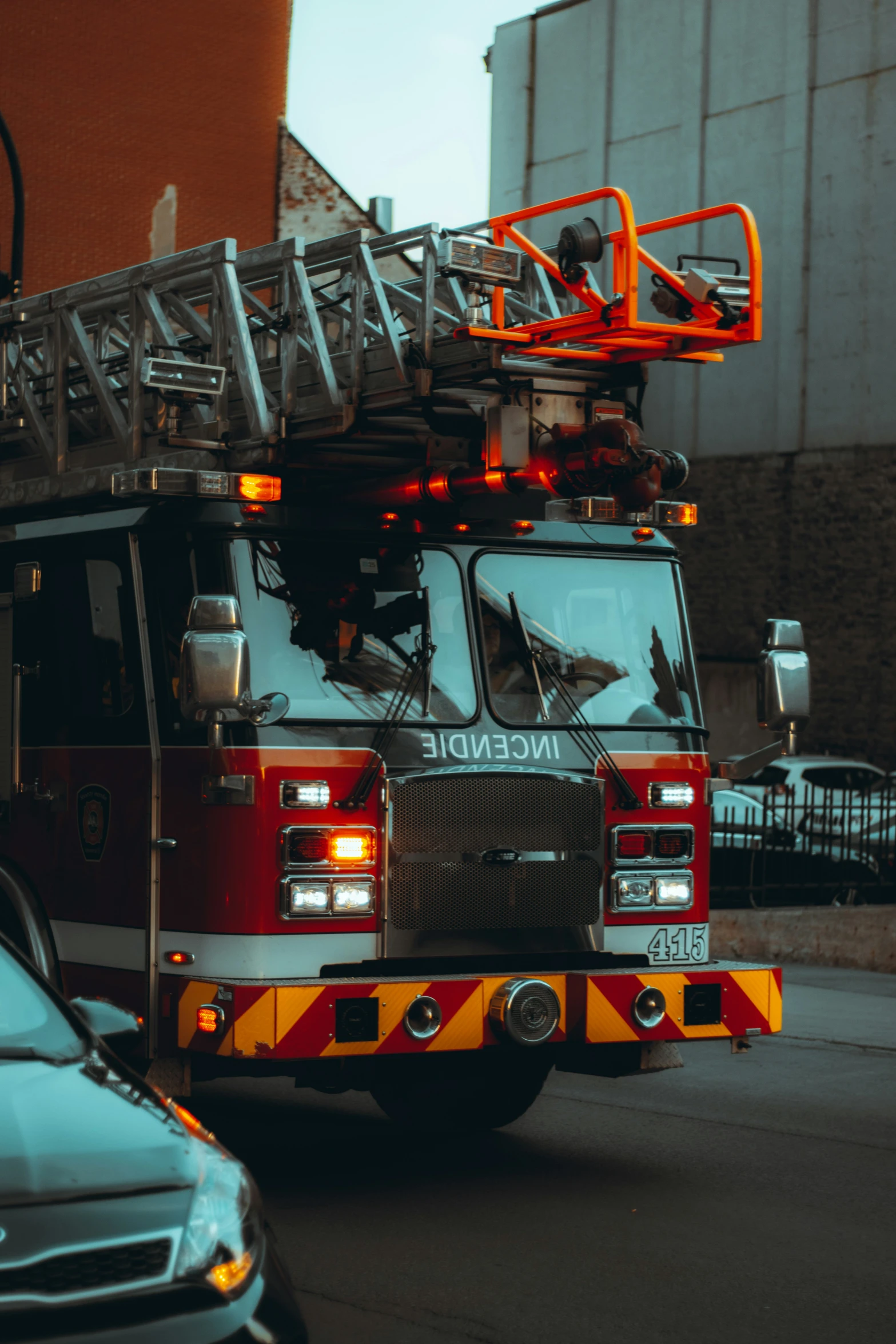 two fire engines parked in front of a brick building