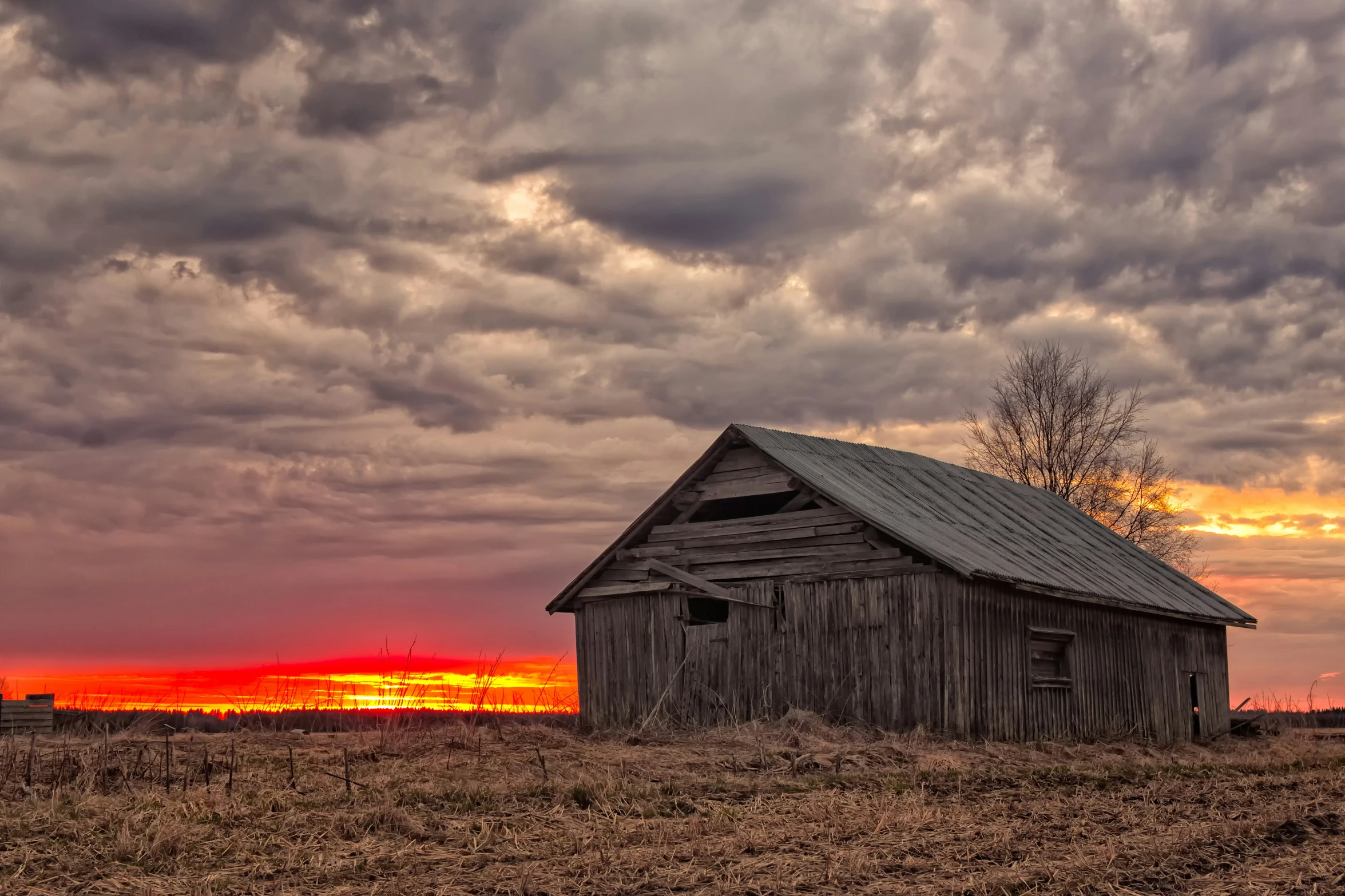 a small wooden house on a field