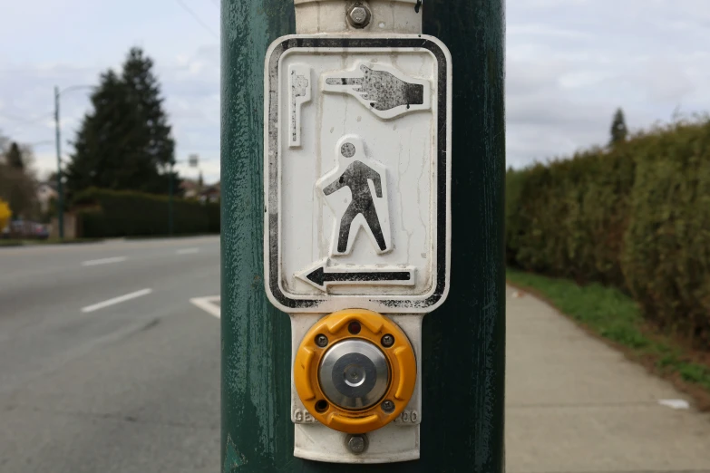 a sign on a pole next to a road