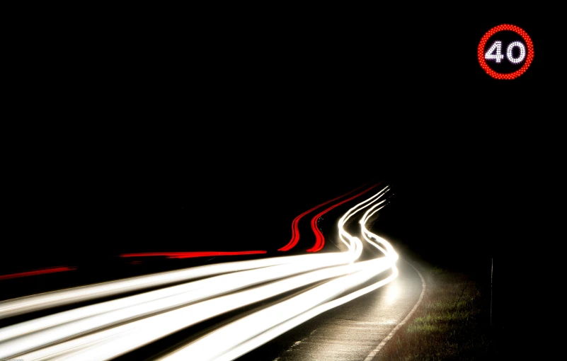 long exposure image of light coming off an overhead freeway
