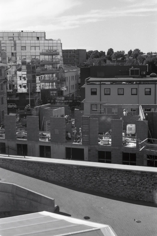 black and white pograph of buildings in city