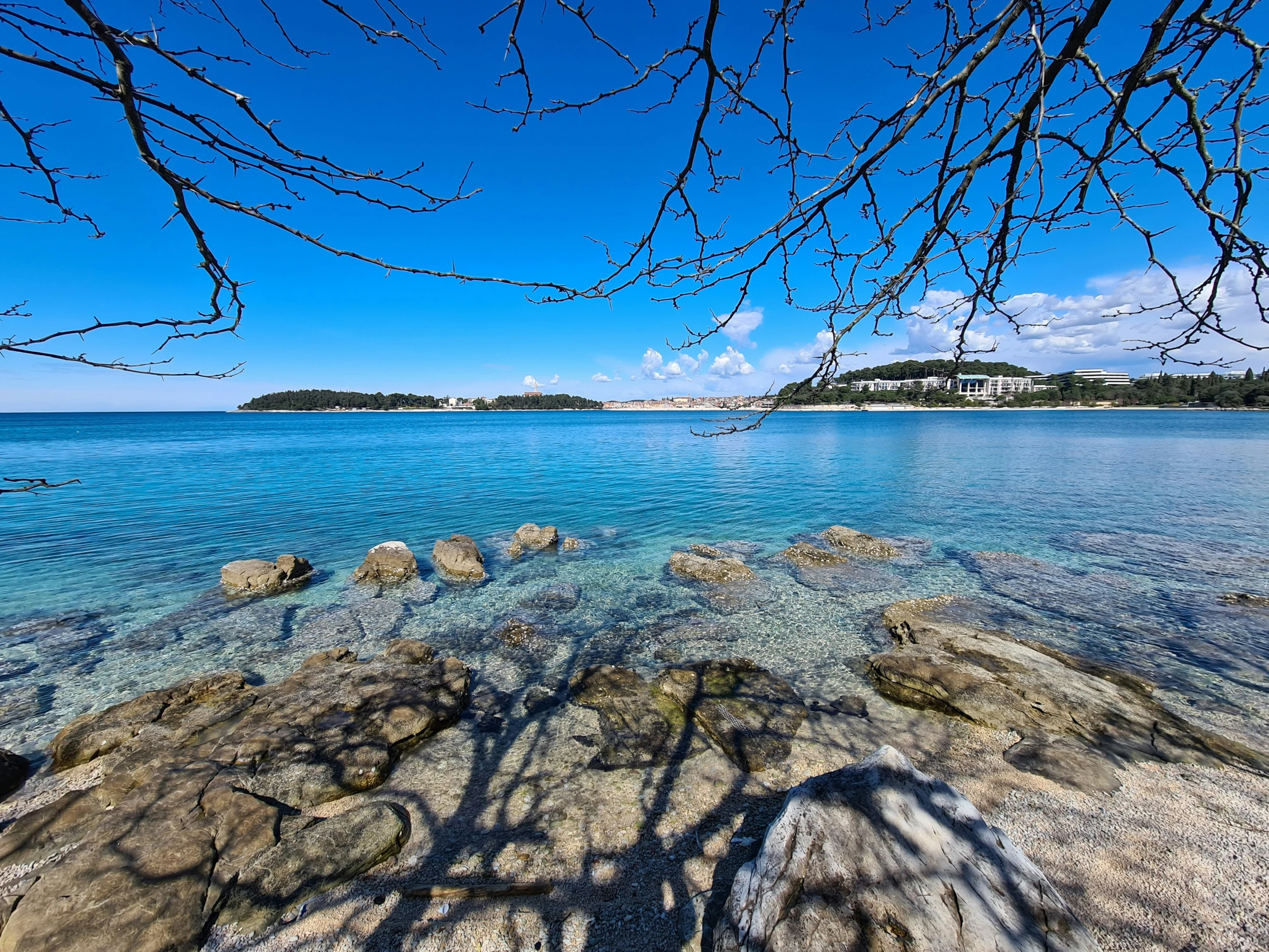 a beach is shown in the blue sky