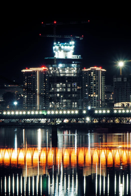 a city skyline lit up by bright lights from its piers