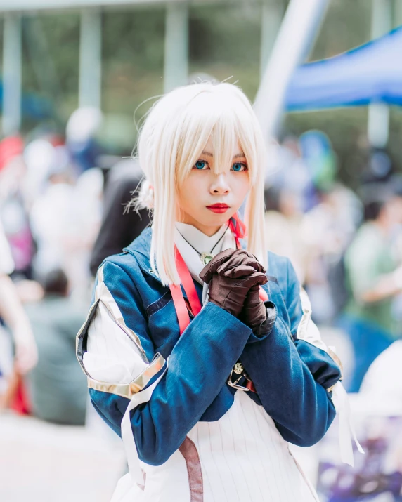 girl in a cosplay holding soing in her hands