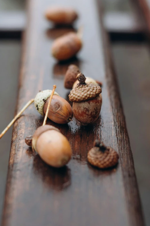 different nuts that are sitting on top of a wooden table
