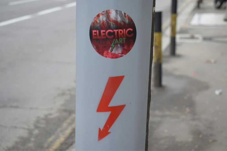 an electric power pole with some graffiti on it