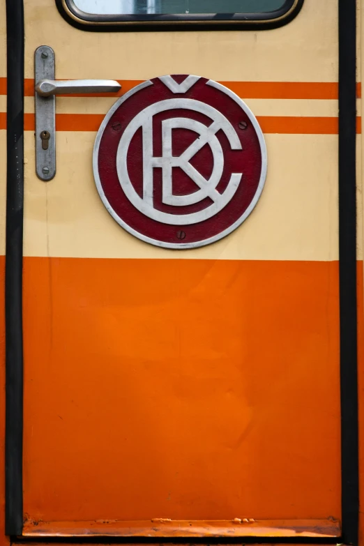 a sign that reads krew is placed on the side of a train