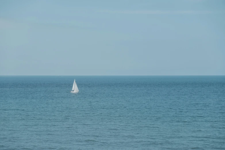 a sailboat is sailing across the ocean