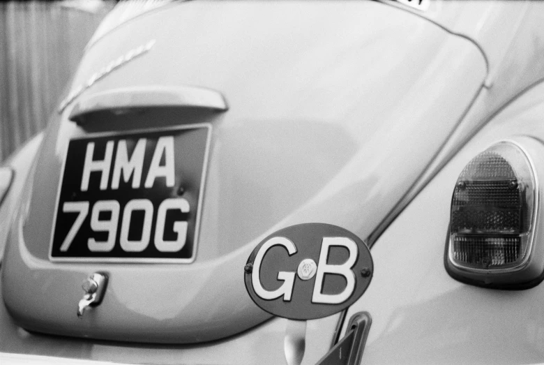 a car with a car tag in black and white