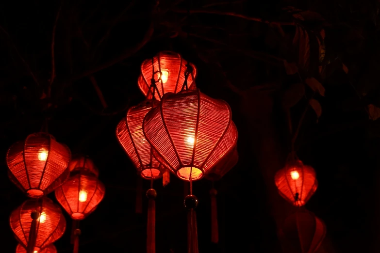 a bunch of red lanterns are lit up