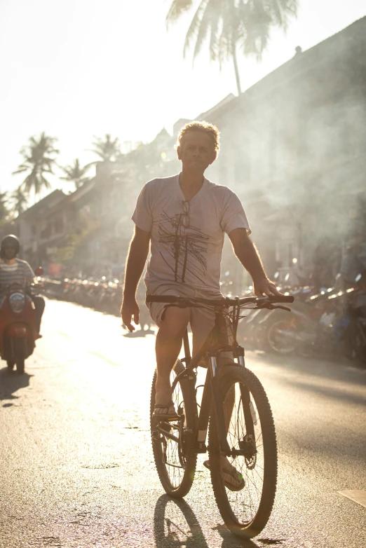 a man is riding a bike on the street