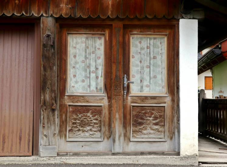 a pair of wooden doors on a house